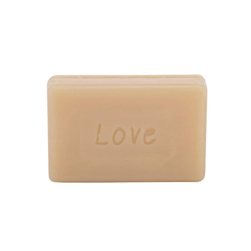Bar of ARTHOUSE soap with 'LOVE' embossed on a white background