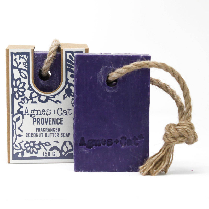 Purple soap bar with rope and packaging labeled 'Agnes + Cat' on a white background