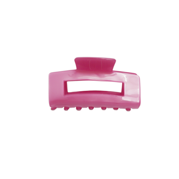 Pink hair clip on a white background