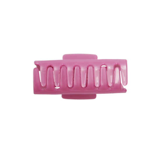 Pink hair clip on a white background
