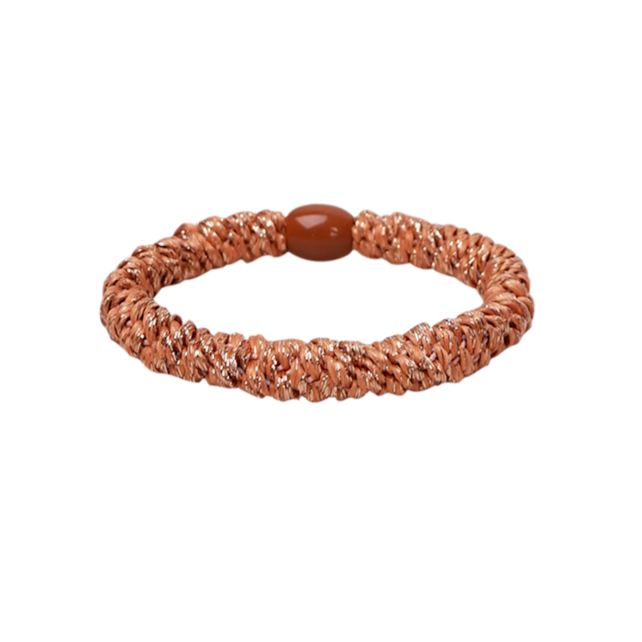 Brown woven bracelet on a white background