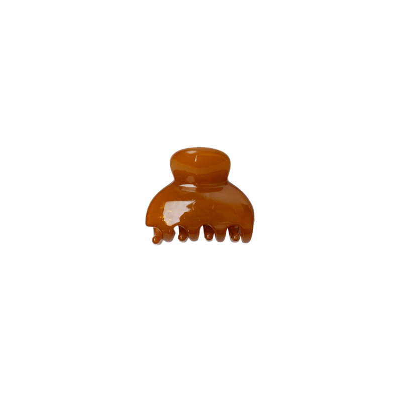 Brown hair clip on a white background