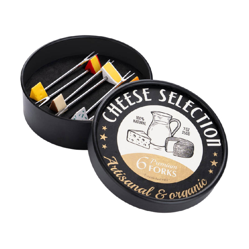 A round black presentation box for cheese forks, shown open with four cheese selection forks inside and the lid placed in front. The lid label reads 'CHEESE SELECTION' and 'Artisanal & organic' with '6 Premium Forks' and 'Handcrafted since 2024.