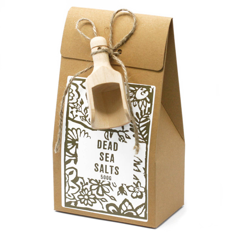 Kraft paper packaging with a decorative label for Dead Sea Salts on a white background