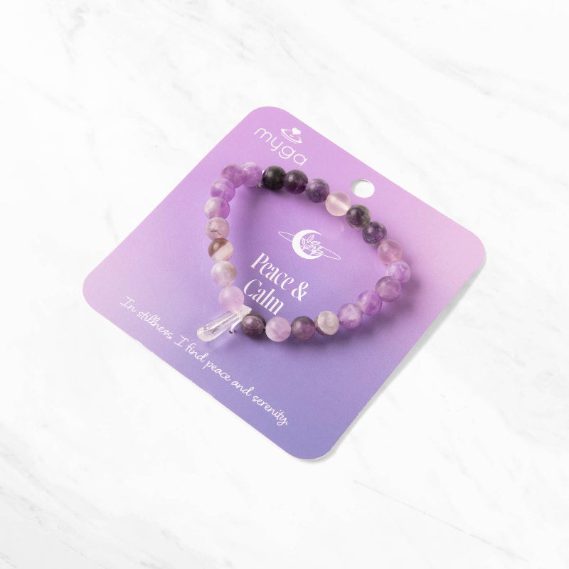 Purple beaded bracelet on a purple card with 'myga' branding on a white background