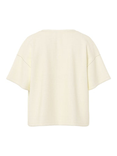 Cream-colored top on a white background