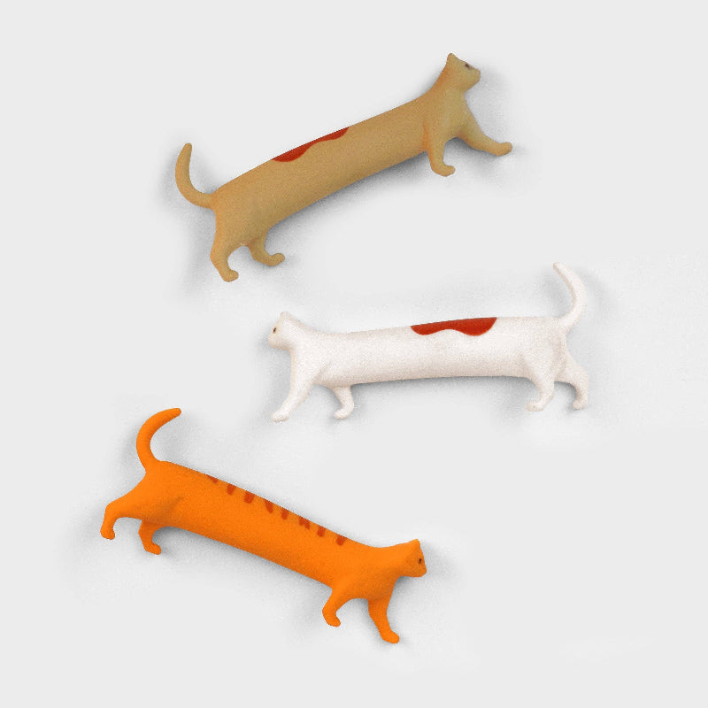 Three Cat Erasers Set in orange, white, and beige on a light grey background