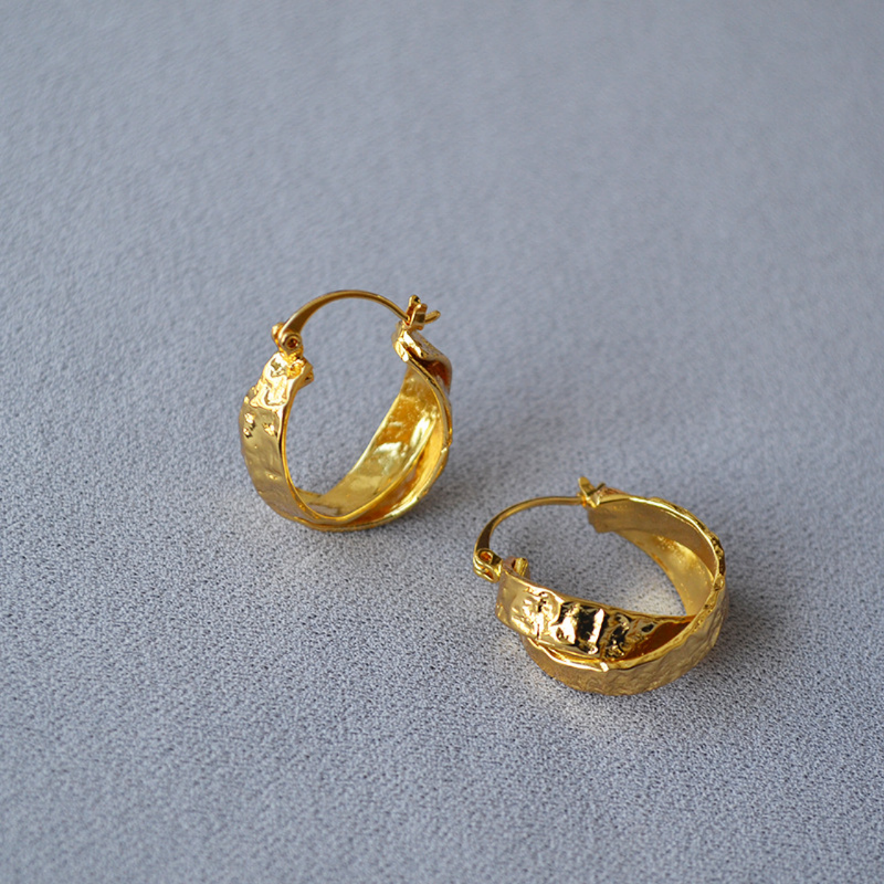 large gold chunky hoop earring with texture