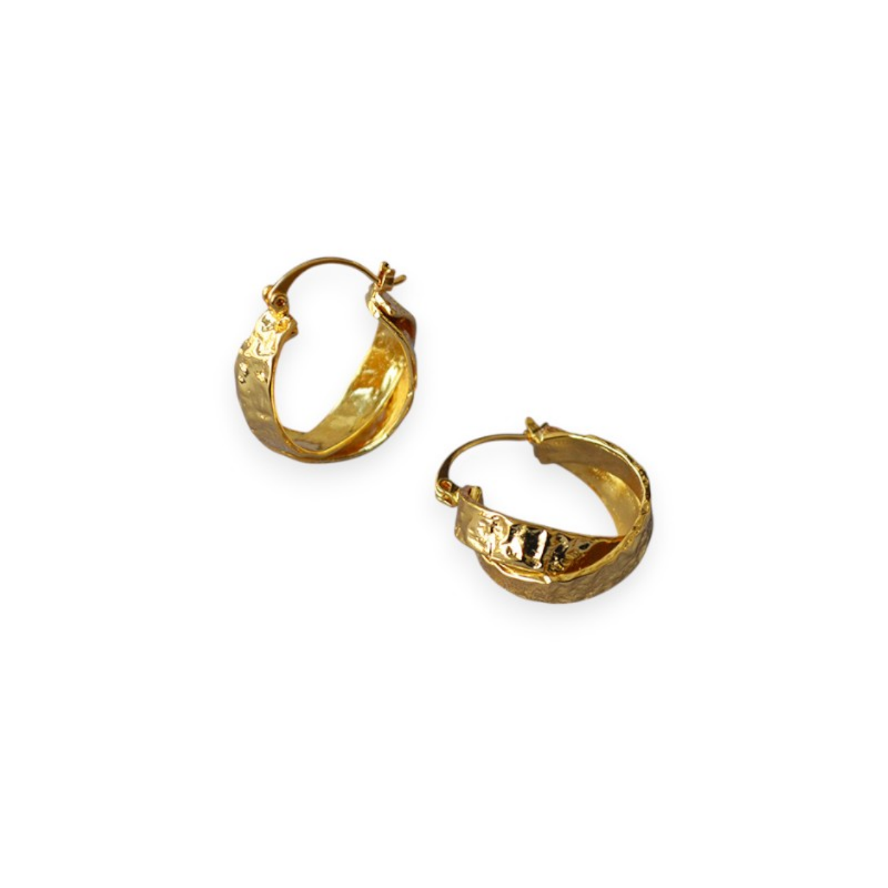 crossed hoop earring with oltem gold texture on white background