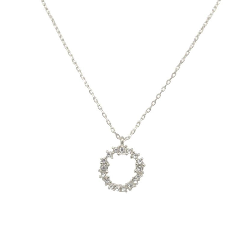 Silver necklace with a circular pendant on a white background