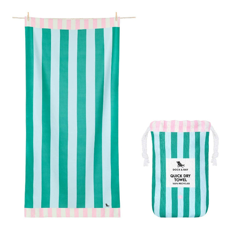 Green and white striped towel with matching drawstring bag on a white background