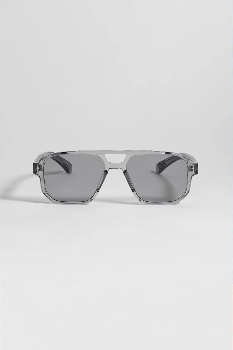 Sunglasses with a reflective surface on a light gray background