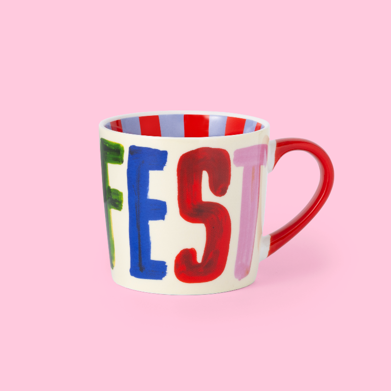 ColoUrful mug with 'MANIFEST' on a pink background