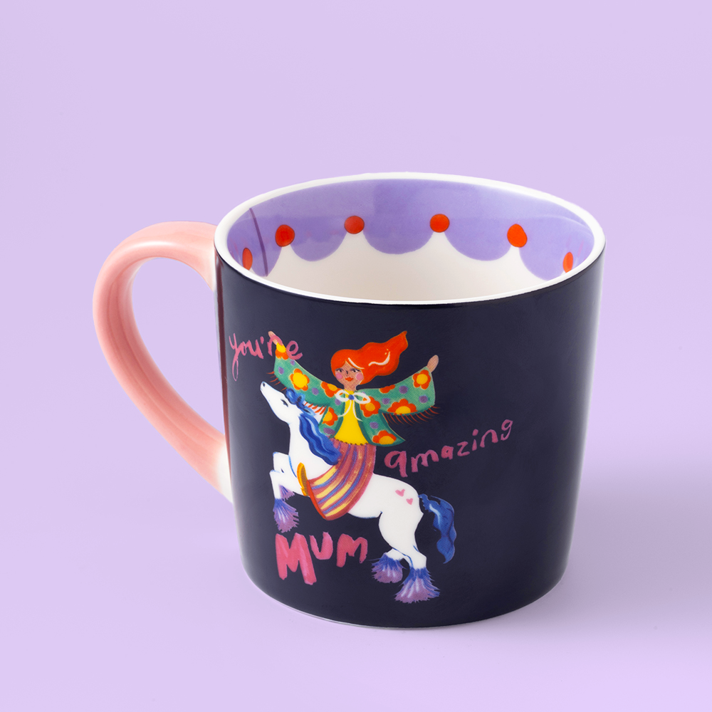 Mug with unicorn and fairy design on a purple background