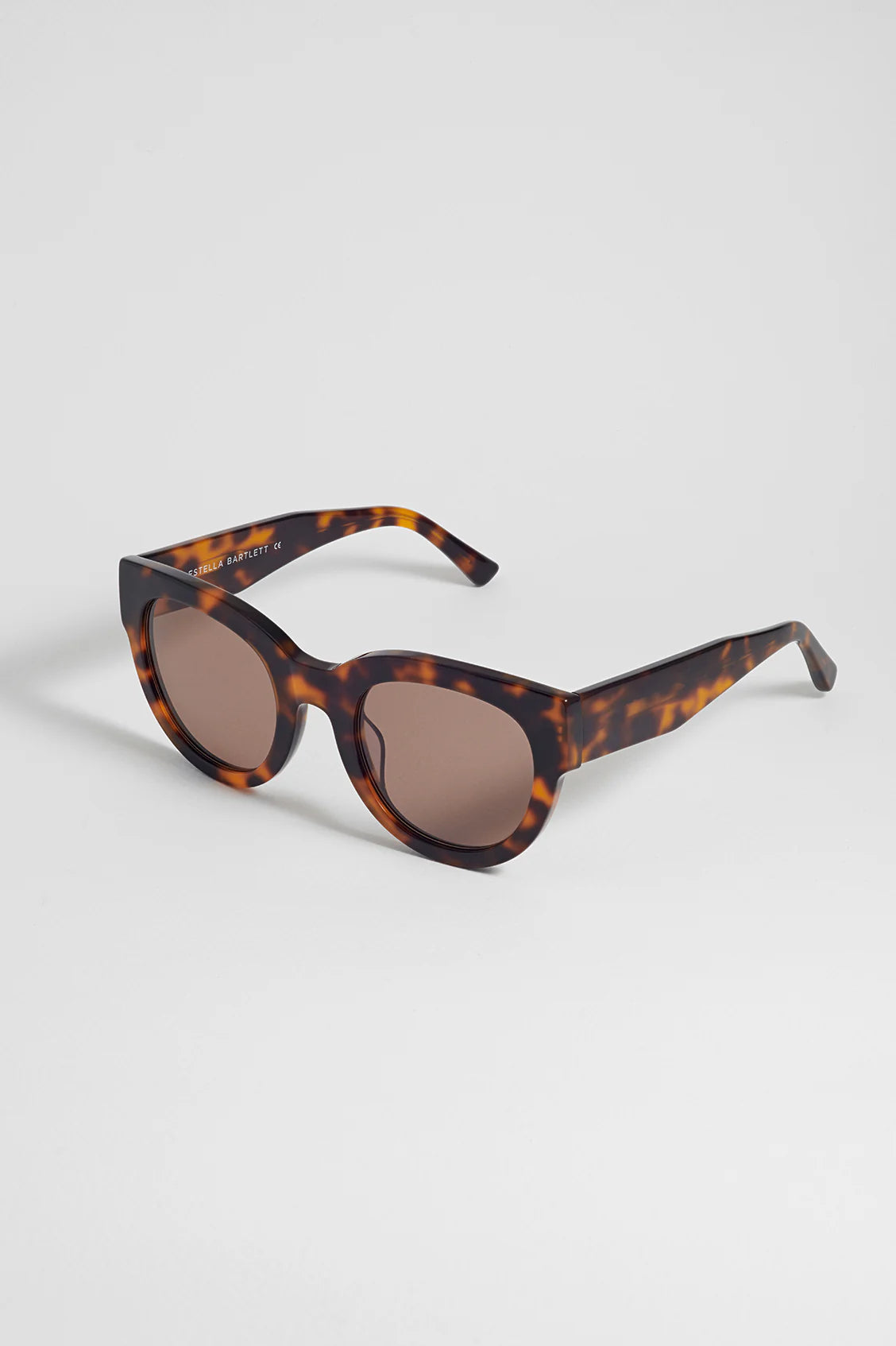 Estella Bartlett Seoul Sunglasses Demi Brown with tortoiseshell frame and brown lenses on a light grey background