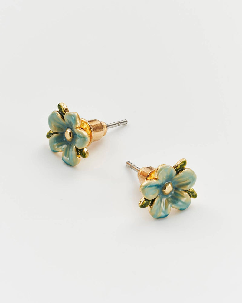 Pair of floral earrings with gold accents on a light gray background
