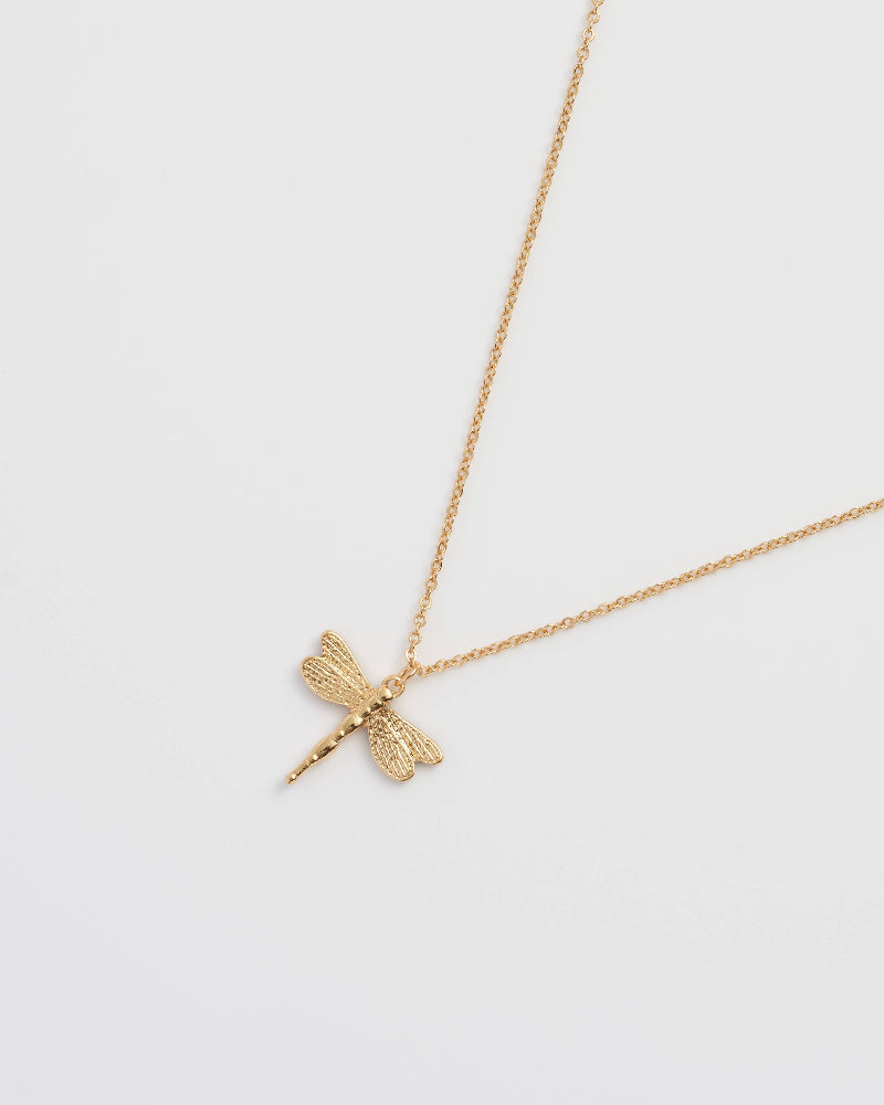 Fable England Gold dragonfly necklace on a light grey background