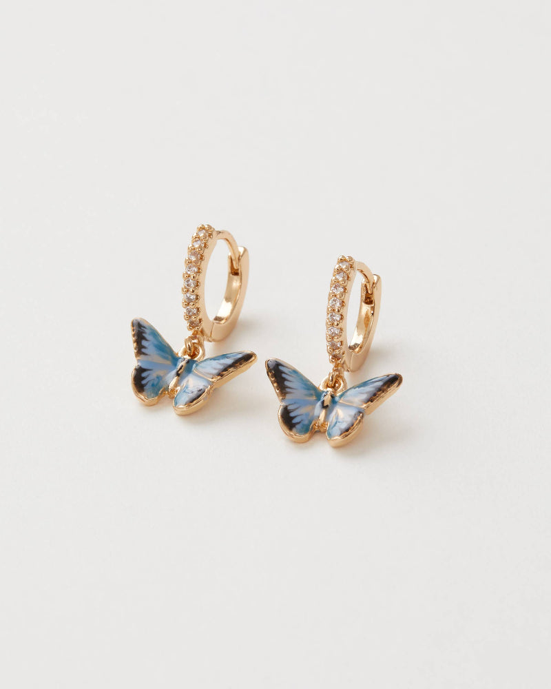 Fable England Butterfly-shaped earrings with gold accents on a light grey background