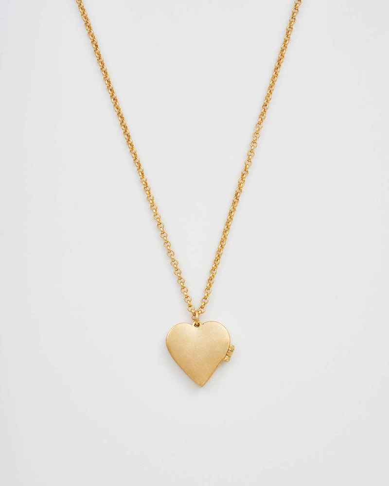 Fable EnglandGold heart-shaped pendant necklace on a light gray background