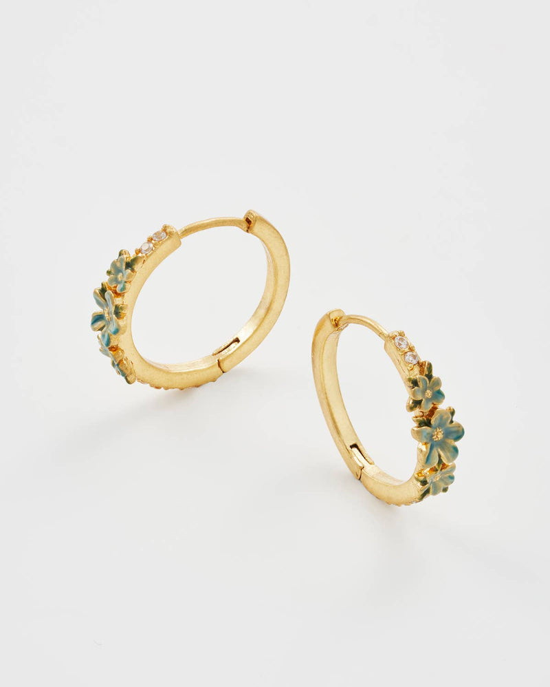 Fable England Gold hoop earrings with green gemstones on a light grey background