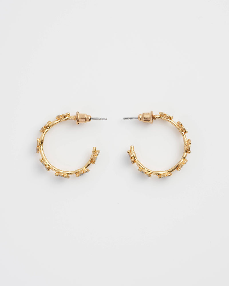 Fable Forget-Me-Not Stud Hoops Gold hoop earrings on a light grey background
