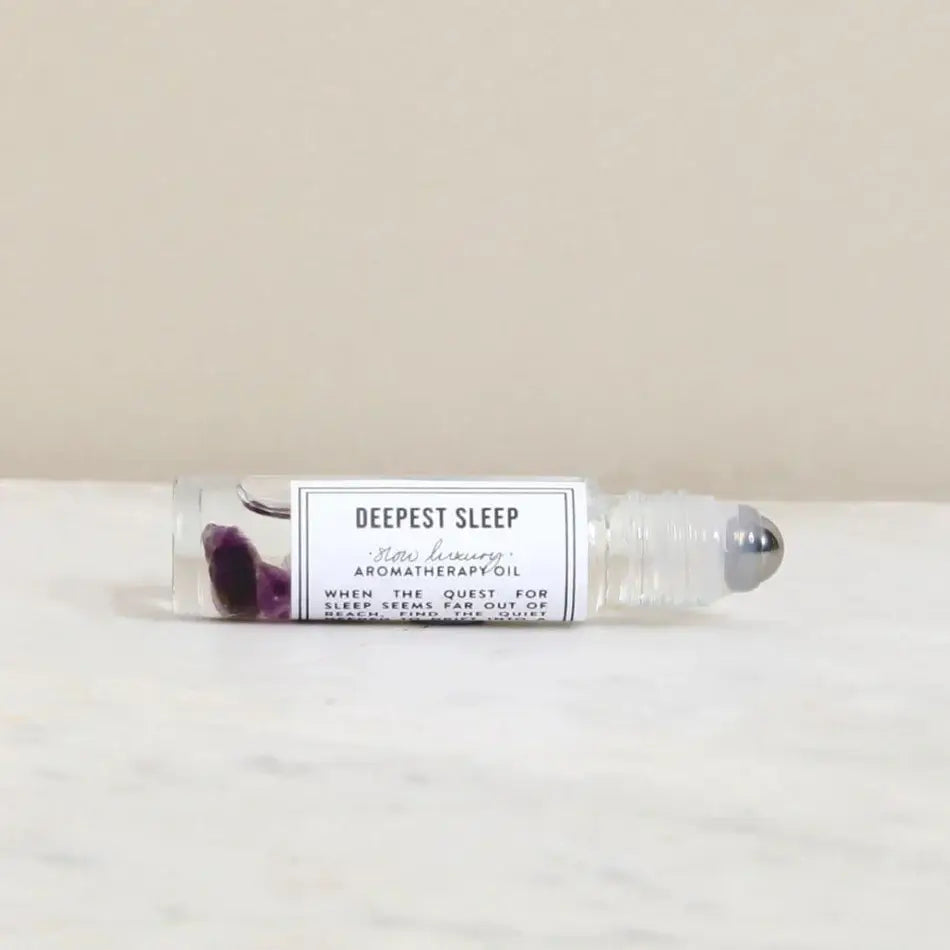 Roll-on bottle labeled 'Deepest Sleep' on a light background