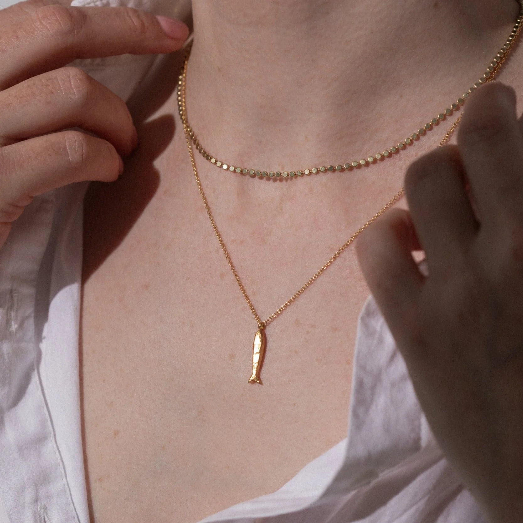 1 & 8 Gold Minnow Necklace on model