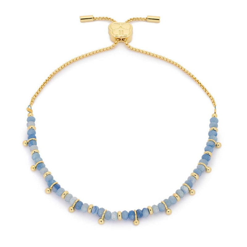 Blue beaded bracelet with gold accents on a white background
