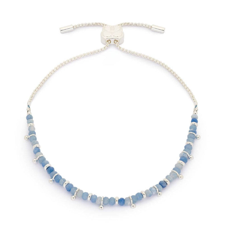 Blue beaded bracelet with silver clasp on a white background