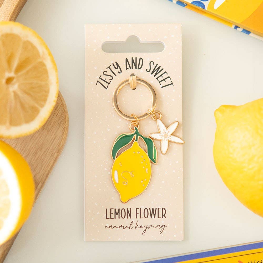 Lemon-themed keychain on a card with lemons in the background
