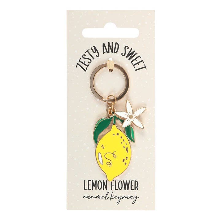 Lemon flower enamel keyring on a card with 'Zesty and Sweet' text