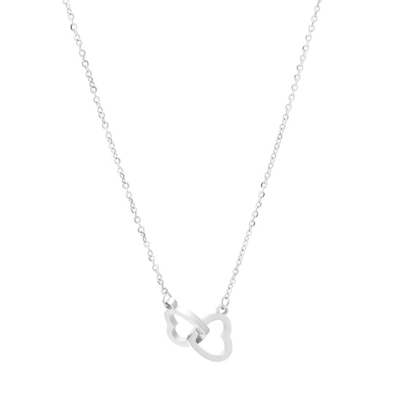 Silver necklace with a heart-shaped pendant on a white background