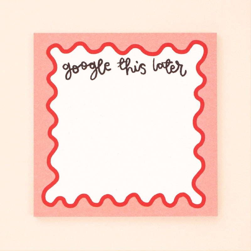 Notepad with decorative border and text 'google this letter' on a beige background