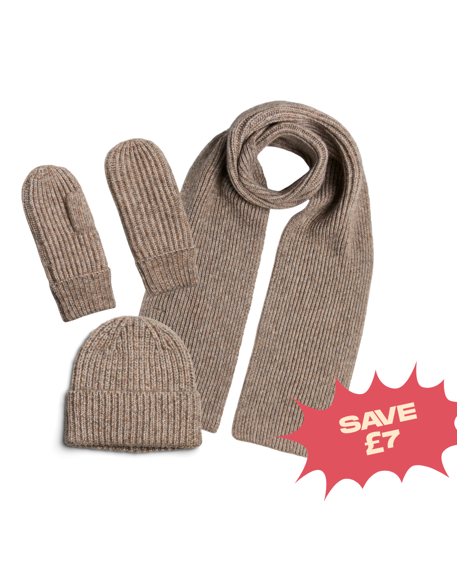 A three-piece knit winter accessory set in a heather taupe-brown color, including a long scarf, a pair of mittens, and a beanie, displayed on a clean white background with a red 'SAVE £7' promotional badge in the lower right corner.