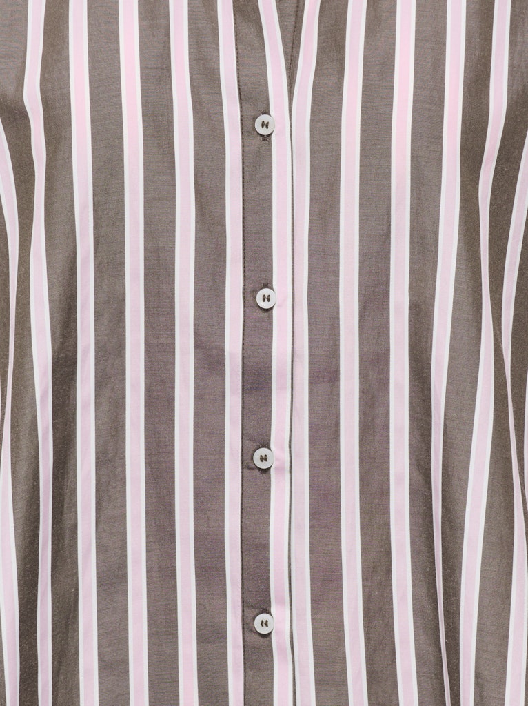 Close-up of a shirt with brown and white vertical stripes.