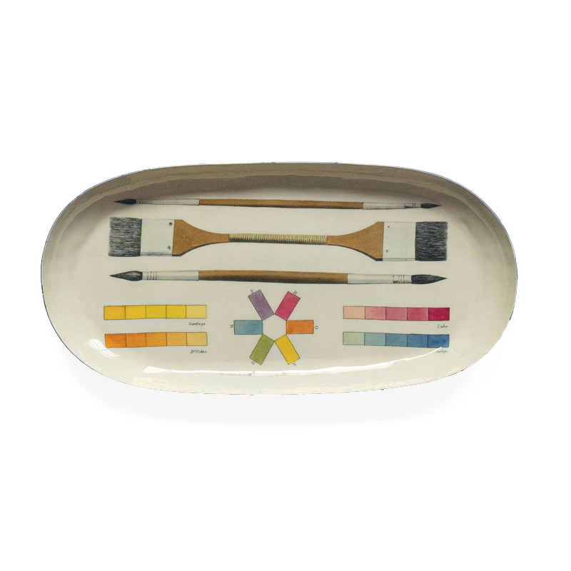 Set of painted on paintbrushes and color swatches on a white background