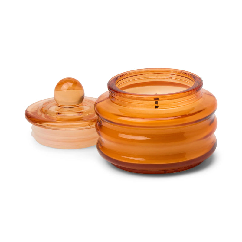 Amber glass jar with lid on a white background