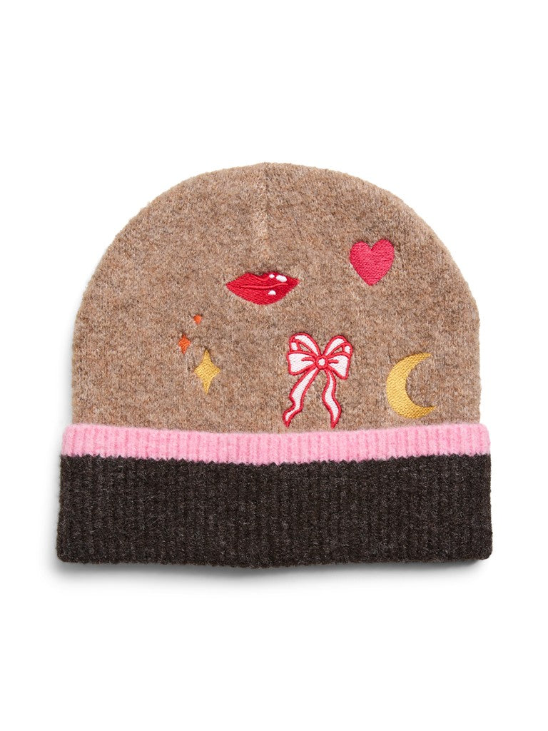 A brown knit beanie hat featuring a pink ribbed cuff and colorful embroidered details including red lips, a pink heart, a pink bow, a yellow crescent moon, and small yellow stars.