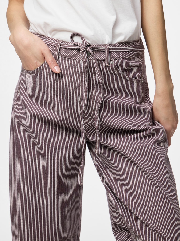 Brown striped pants with a tie waist worn by a person on a white background