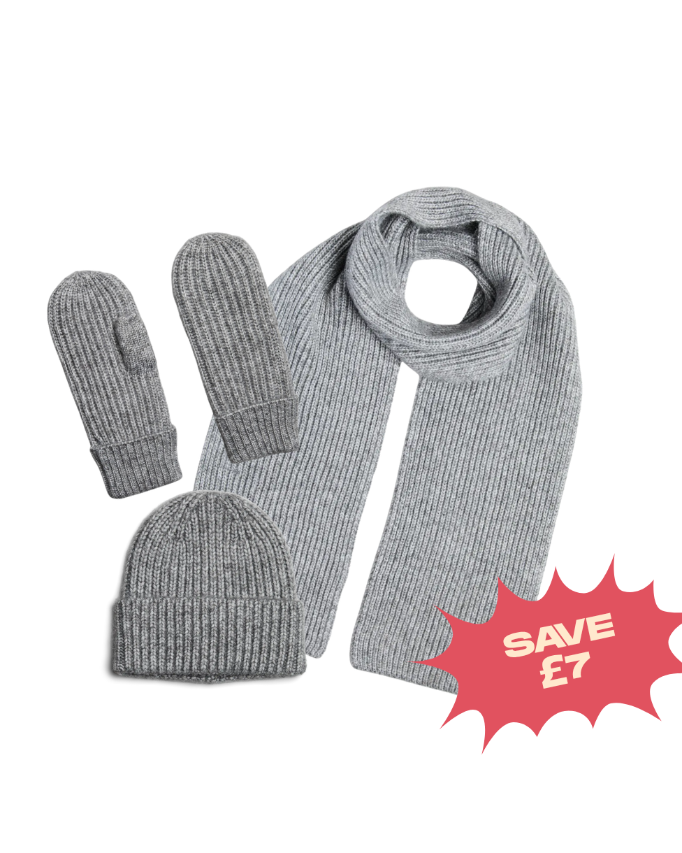 A light gray ribbed knit winter accessory set including a scarf, a beanie, and mittens, displayed on a white background with a red 'SAVE £7' promotional badge in the lower right corner.