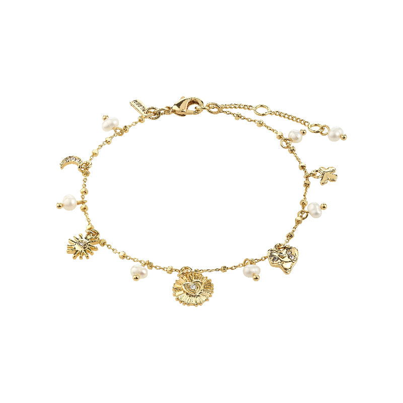 Gold bracelet with moon and heart charms on a white background