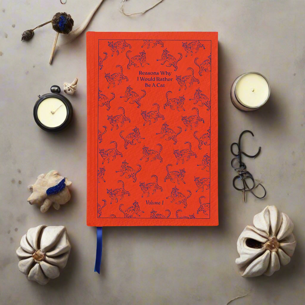 Red notebook with cat illustrations on a white background