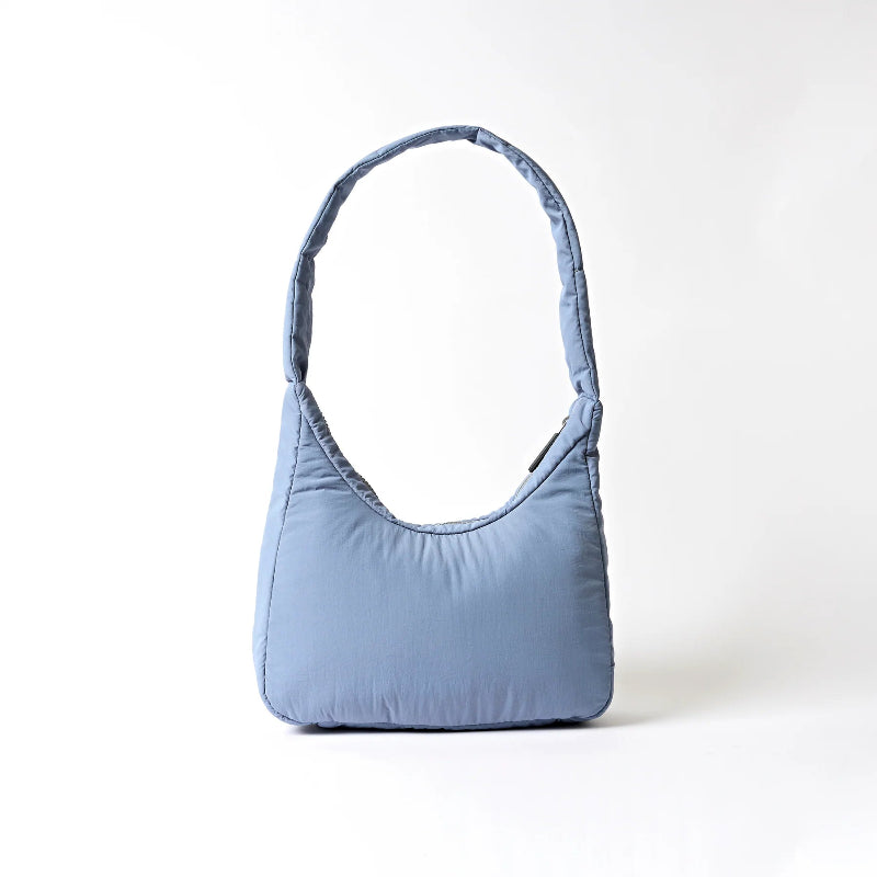 Light blue handbag on a white background