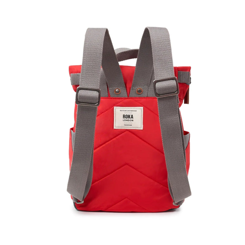 Red backpack with gray straps on a white background