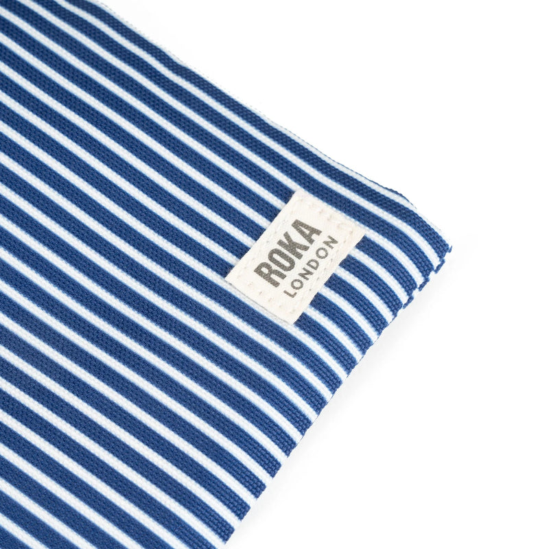 Folded blue and white striped fabric with 'Ori London' label on a white background