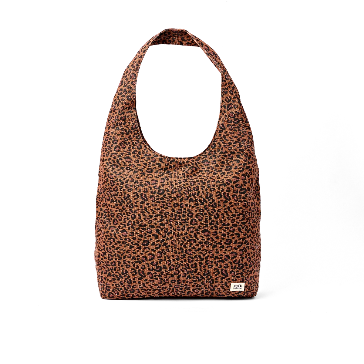 A slouchy hobo shoulder bag with a brown and black leopard print pattern, featuring a small white brand tag on the bottom right corner, set against a plain white background.
