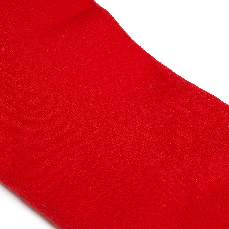 Close-up of a red sock with a white background