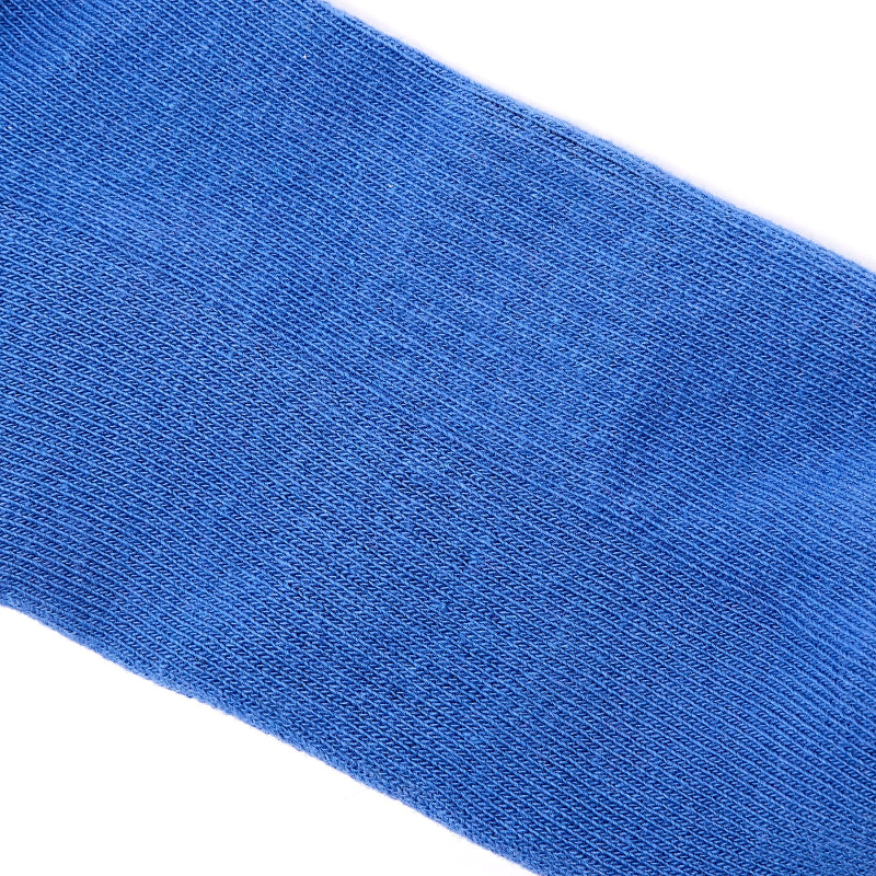 Close-up of a blue sock on a white background