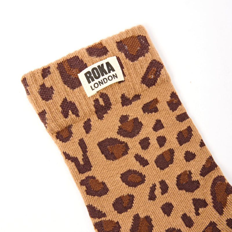 Leopard print sock with Roka London label on a white background