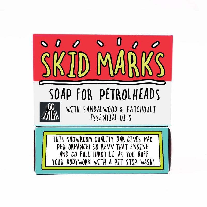 Soap bar packaging for 'Skid Marks' soap with sandalwood and patchouli essential oils on a white background.